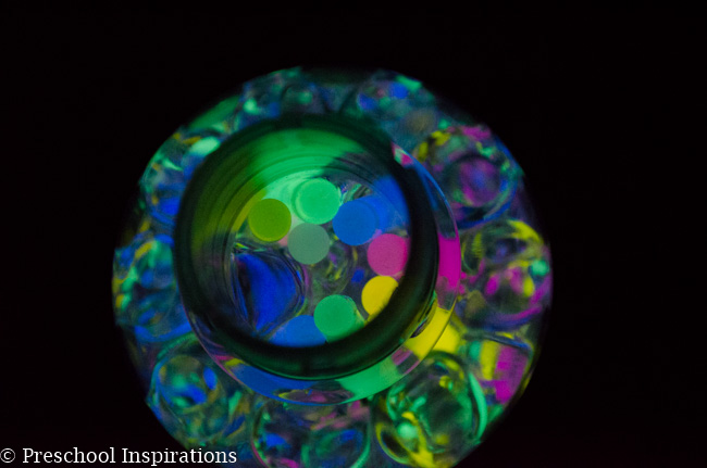 Make a super simple glow in the dark sensory bottle with glow sticks and water beads-3