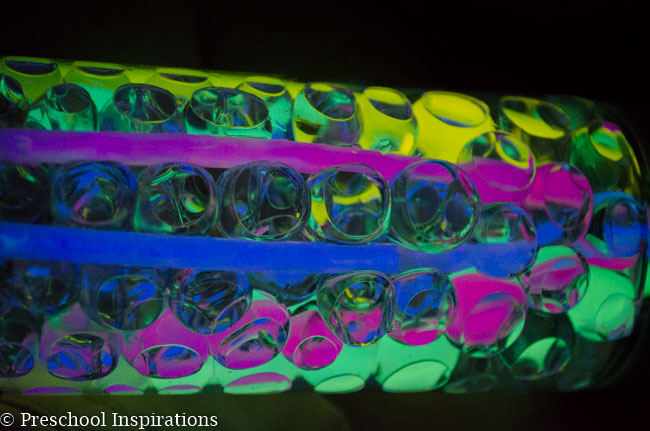 Make a super simple glow in the dark sensory bottle with glow sticks and water beads-5