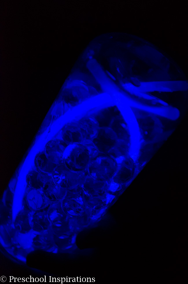 Make a super simple glow in the dark sensory bottle with glow sticks and water beads-9