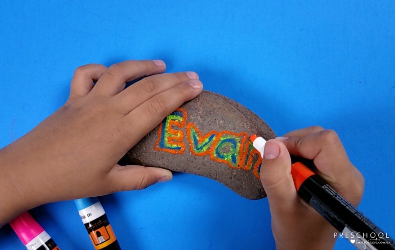 Teach children to write with a name rock.