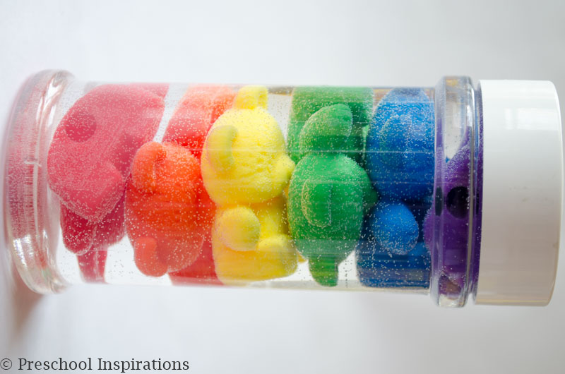 Make a rainbow counting bear sensory bottle. Perfect for a rainbow theme.